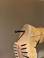 Tan suede boot with chunky tread sole and stitched upper seam