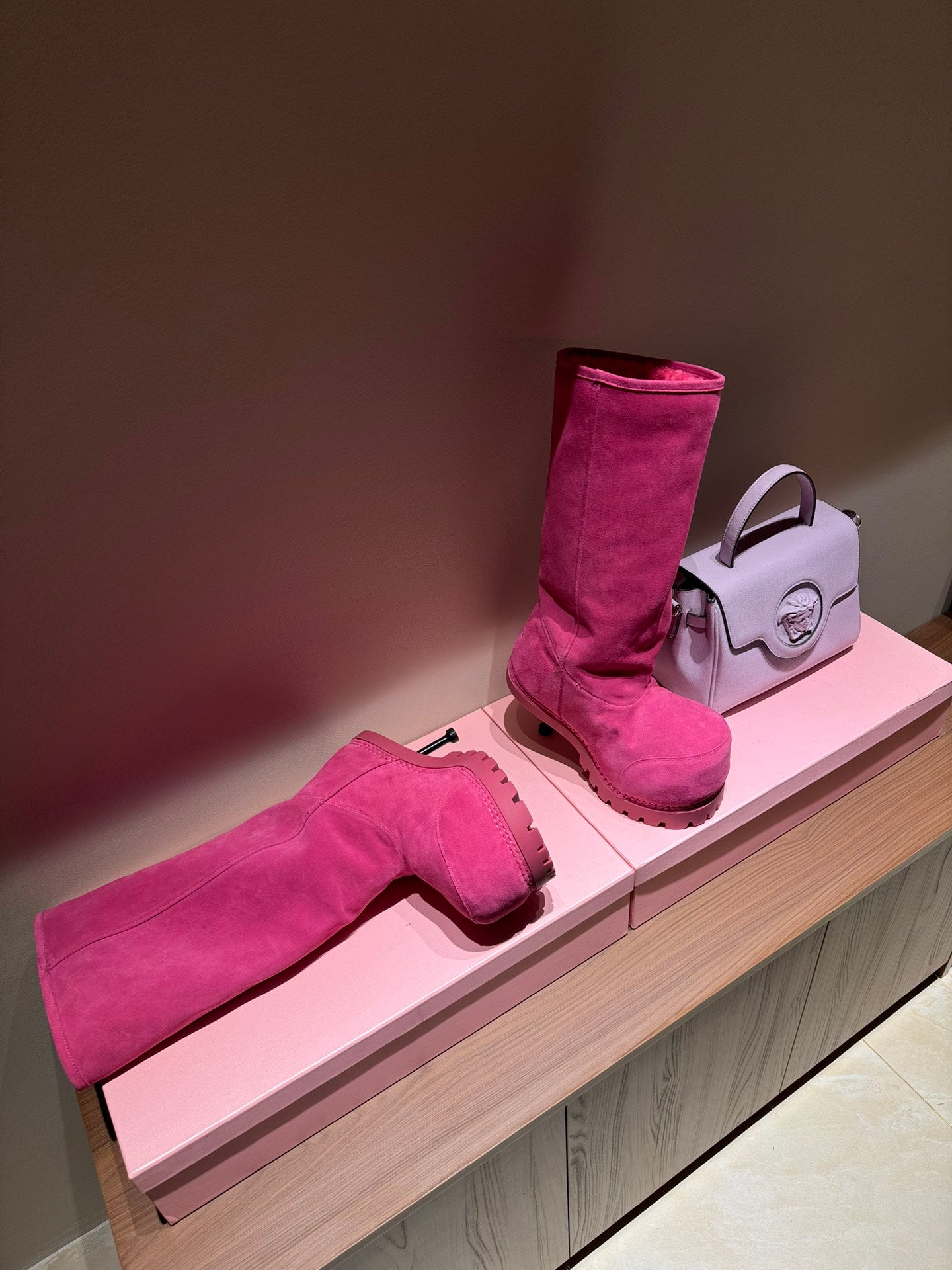 Women's Balenciaga magenta suede boots with tall shaft and chunky lug sole