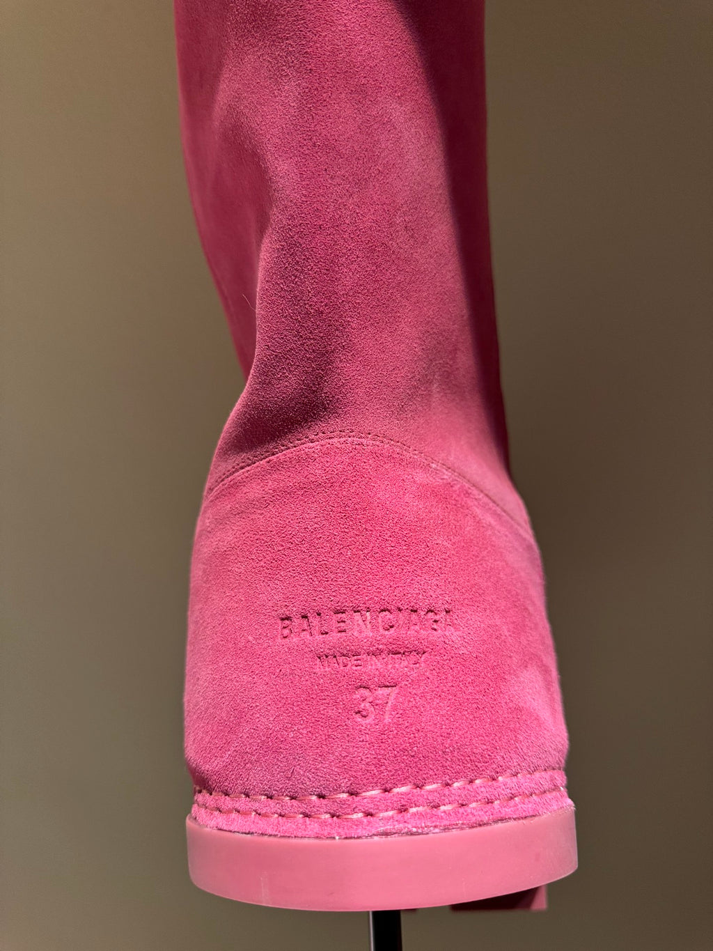 Women's Balenciaga magenta suede boot heel showing 'Balenciaga' stamp and stitching