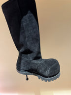 Dark suede knee-high boots with side seam and textured tread sole