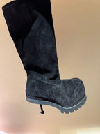 Black suede mid-calf boot with thick tread sole and side seam