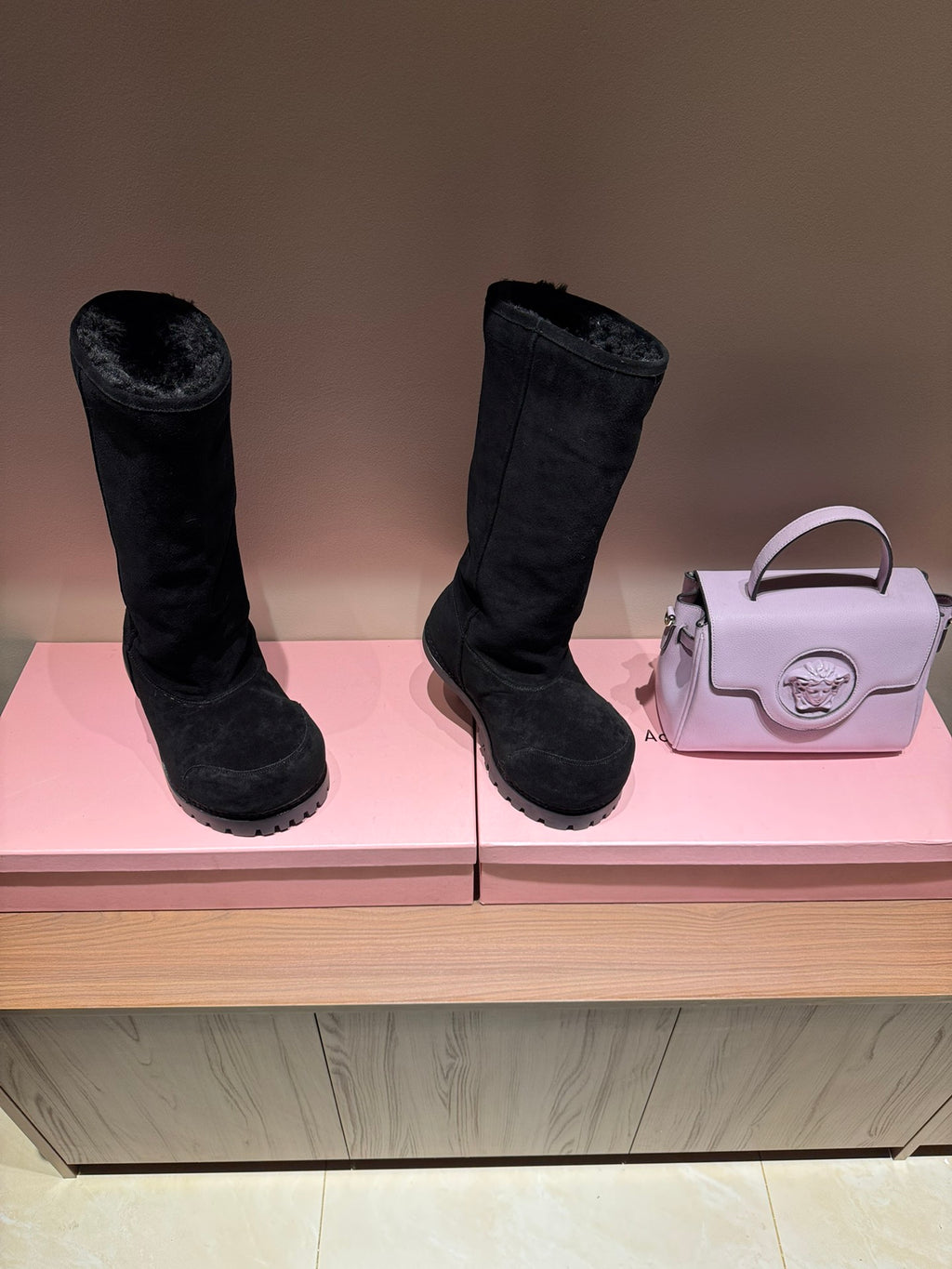 Black suede mid-calf boots with thick outsole and rounded toe
