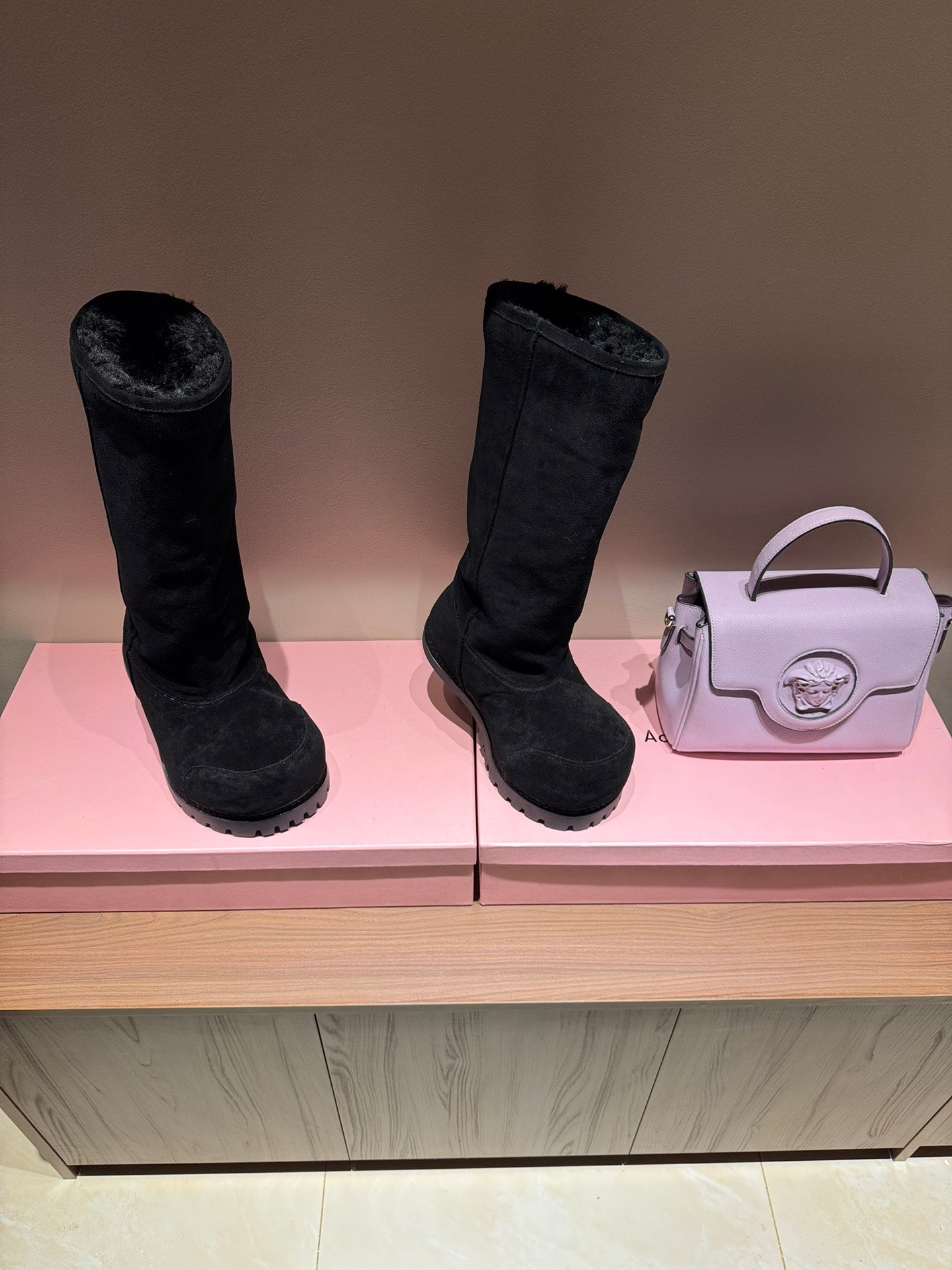 Black suede mid-calf boots with thick outsole and rounded toe