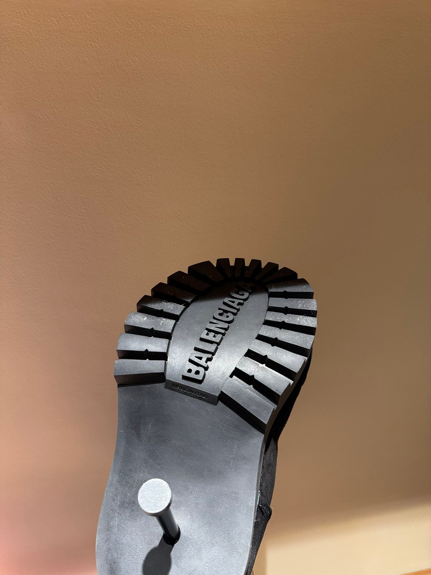 Black suede boot sole with BALENCIAGA logo and ribbed tread