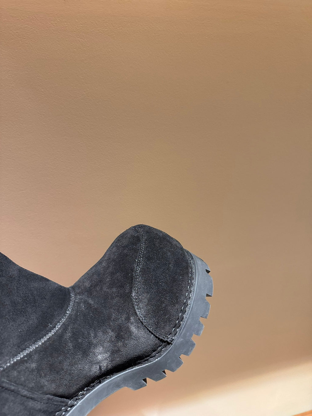 Grey suede ankle boot with side seam and rubber tread sole