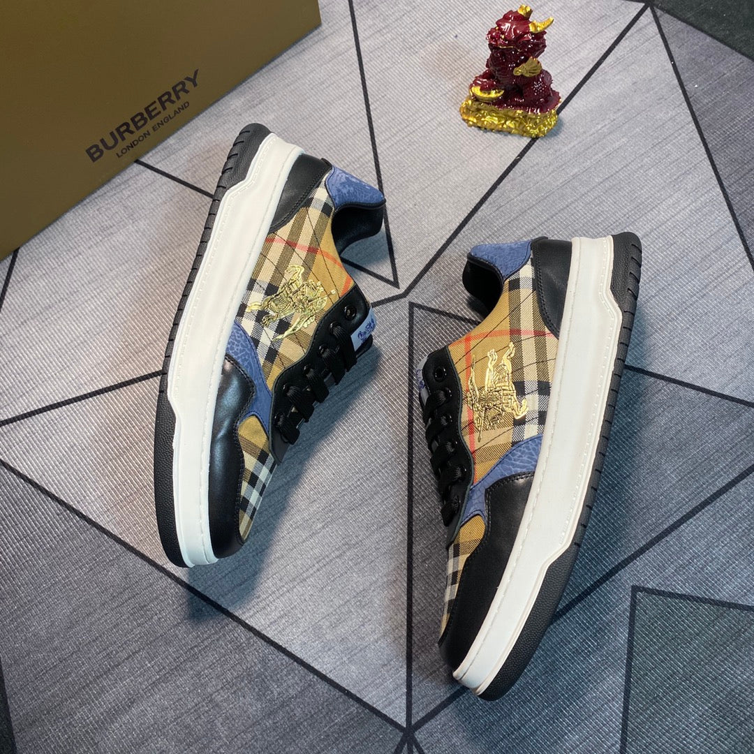 Burberry low-top sneakers shown from the side with plaid panels, gold emblem, white rubber sole