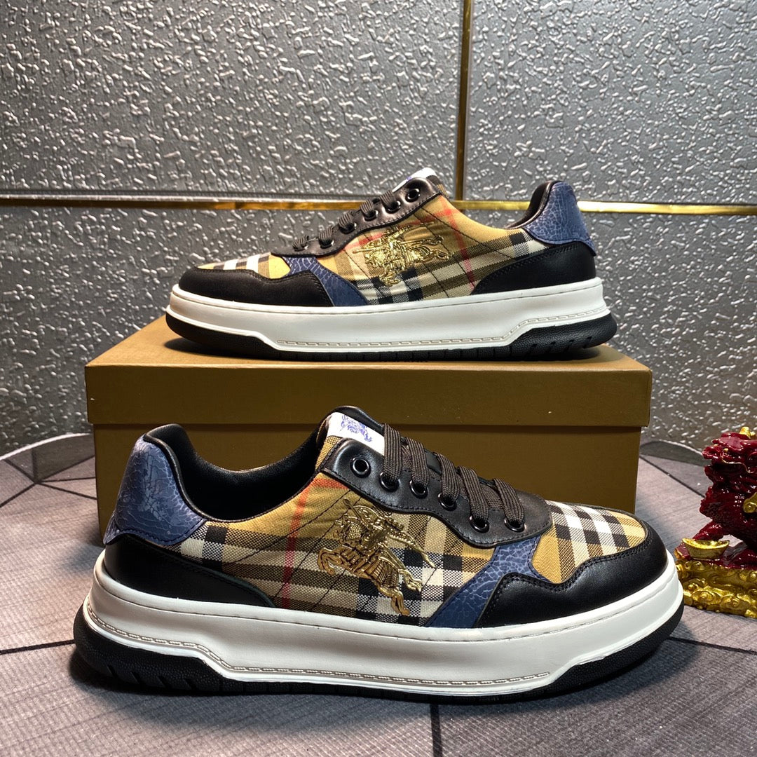 Burberry low-top sneakers on box step with black uppers, plaid patch, gold emblem, white sole