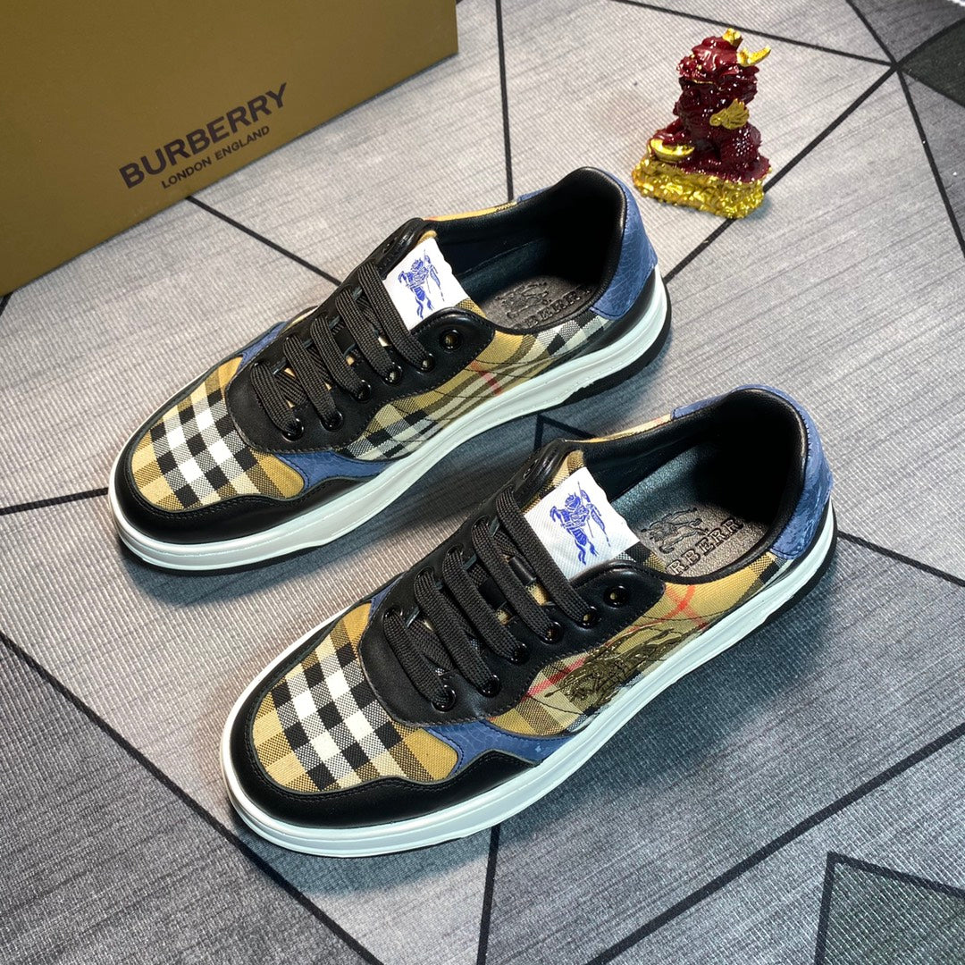 Burberry lace-up sneakers with black leather, navy-and-cream check overlays, blue detail, white sole