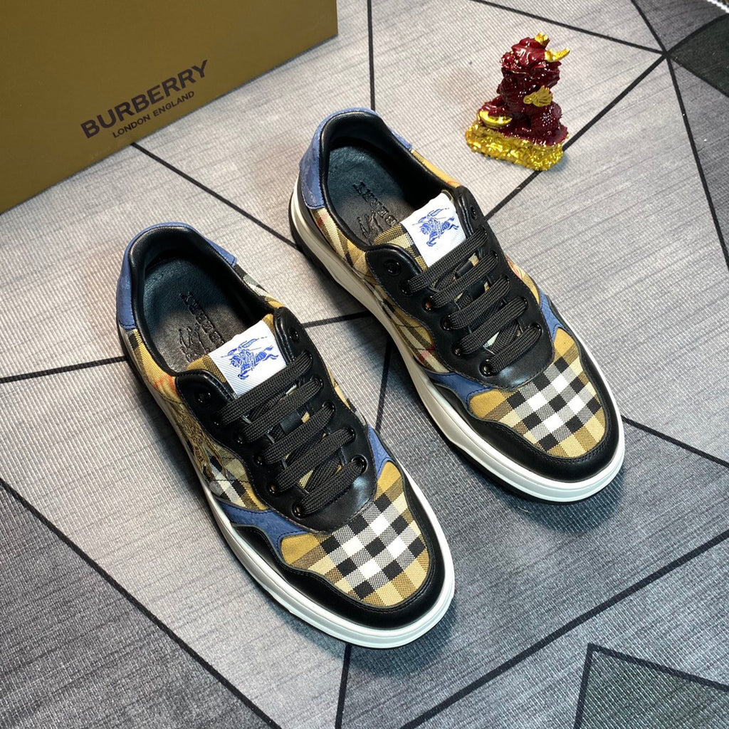 Burberry pair of lace-up sneakers with black uppers, plaid front, blue panels, white sole