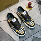 Burberry pair of lace-up sneakers with black uppers, plaid front, blue panels, white sole