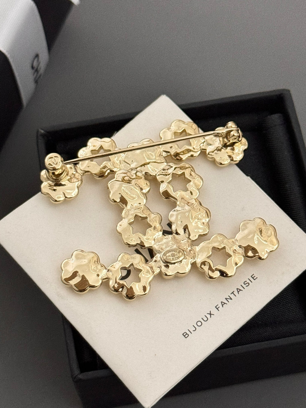 Chanel gold-tone statement brooch with floral charms on card, black box base