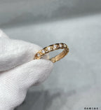 Gold-toned oval pavé ring with clear stones