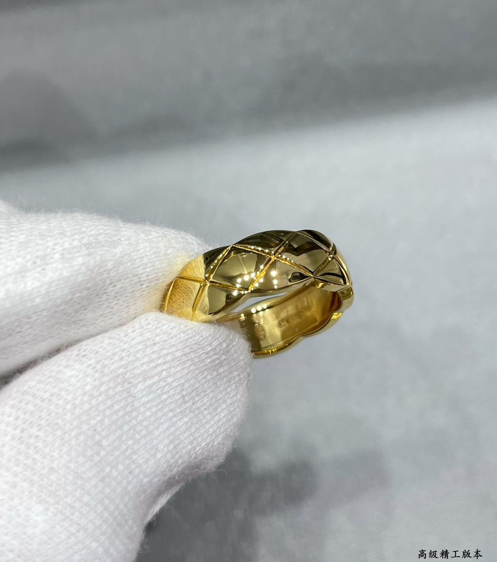 Gold tone faceted band ring with diamond-like woven texture
