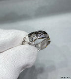 Silver tone textured band ring with faceted geometric pattern