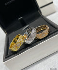 Chanel accessories: gold and silver-tone ring set with pavé stone detailing