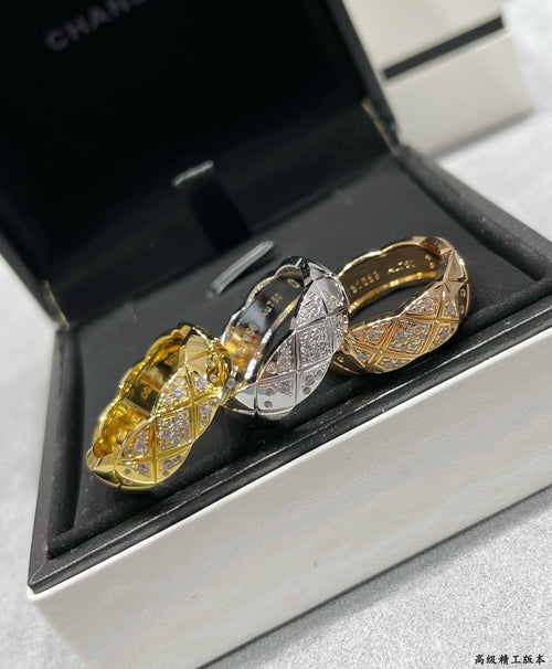 Chanel accessories: gold and silver-tone ring set with pavé stone detailing
