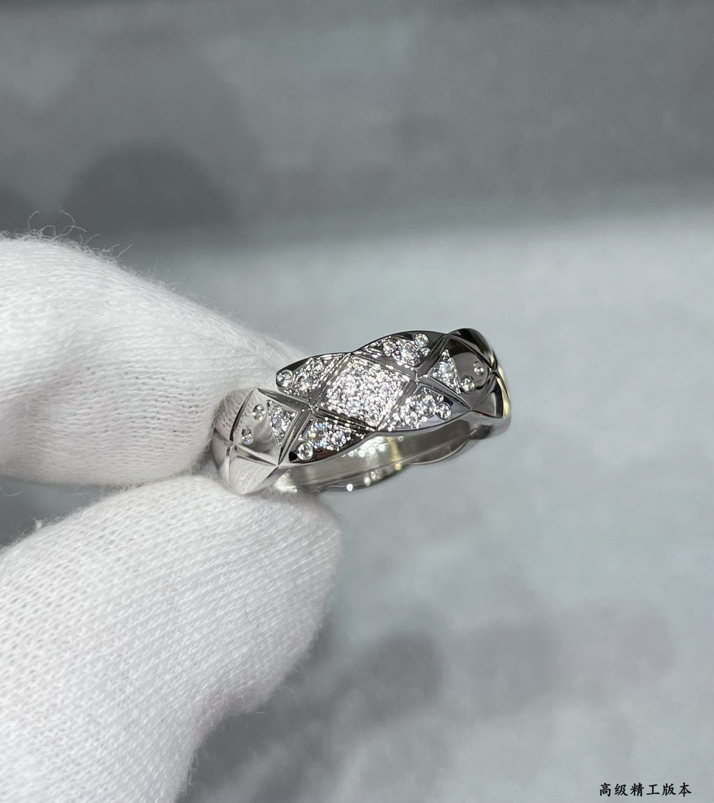 Chanel accessories: silver-tone ring with crisscross pavé stone design