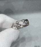 Chanel accessories: silver-tone ring with crisscross pavé stone design