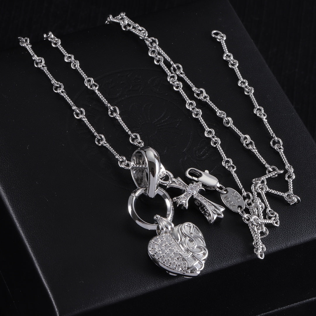 Heart locket and cross pendant necklace on chain, silver tone