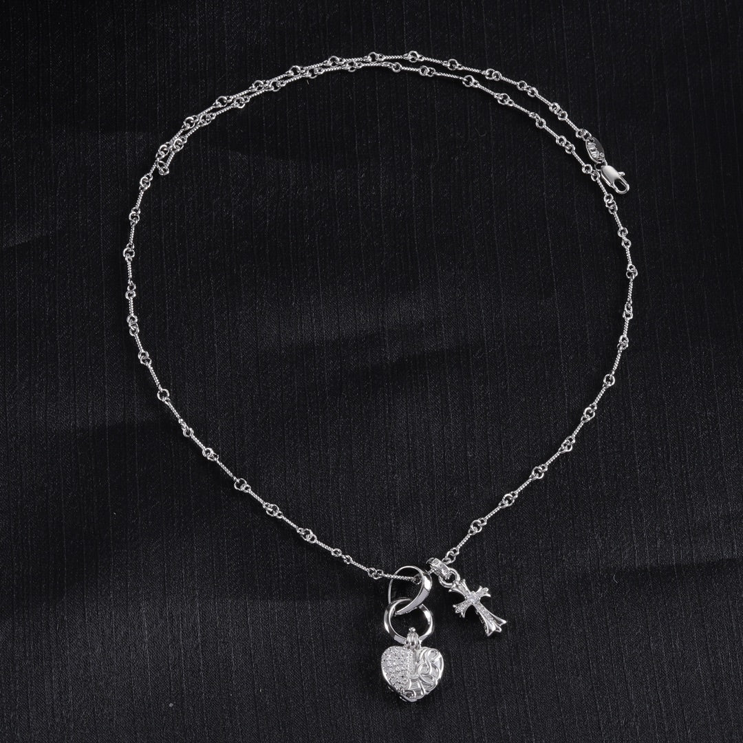 Single heart locket and cross pendant necklace with linked chain, silver tone