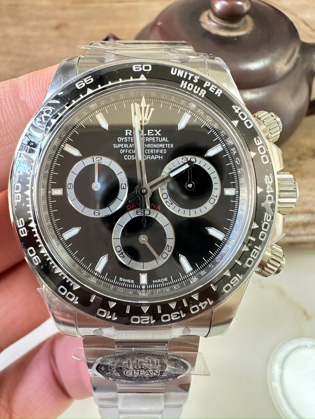 Steel chronograph watch with black dial, three subdials and tachymeter bezel