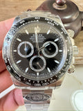 Steel chronograph watch with black dial, three subdials and tachymeter bezel