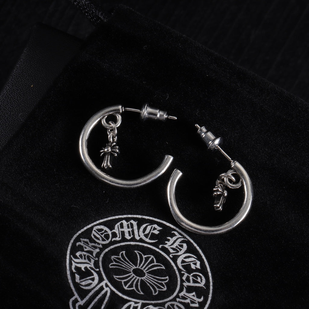 Silver hoop earring with star charm and post stud, close front view