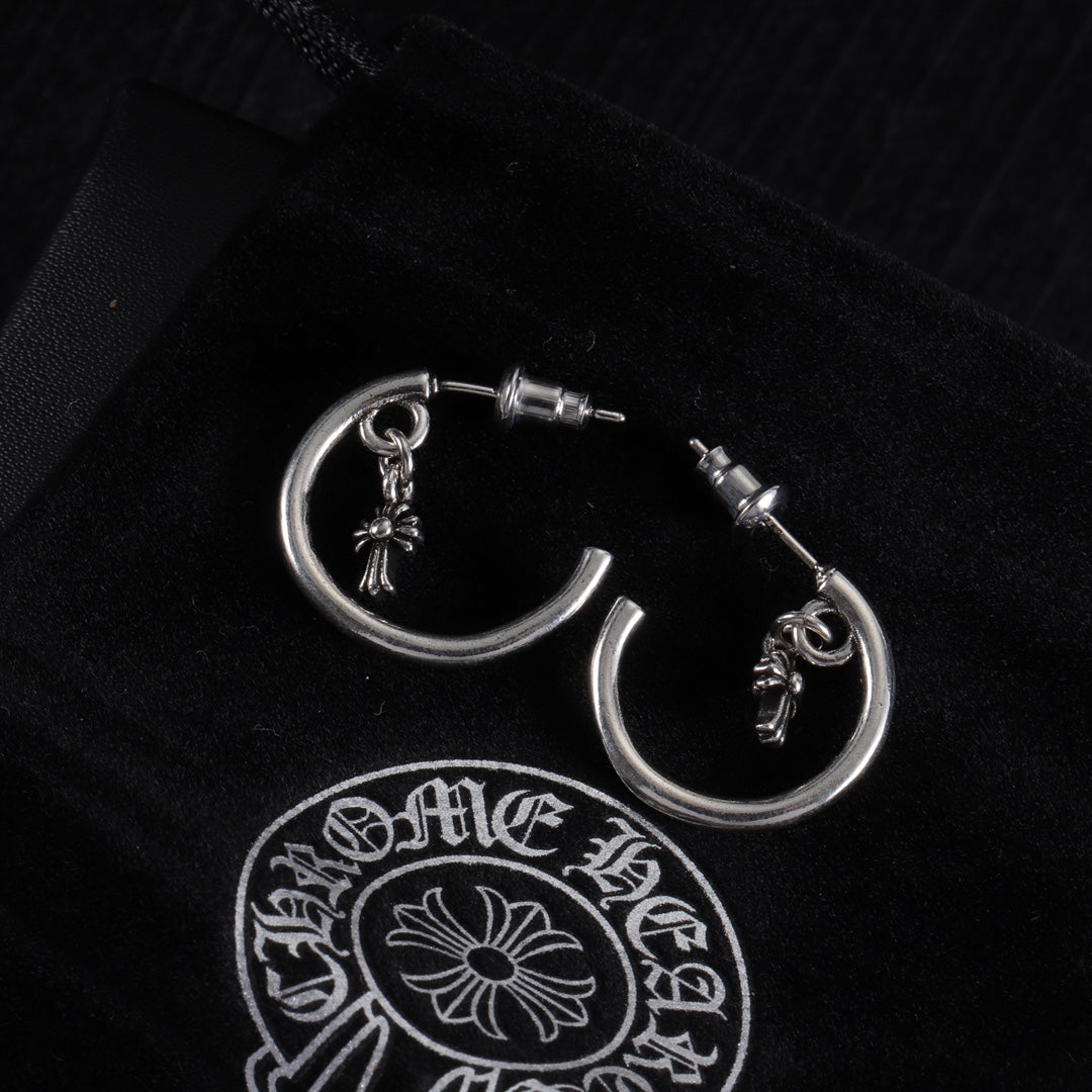 Silver hoop earring with star charm and post stud, close front view