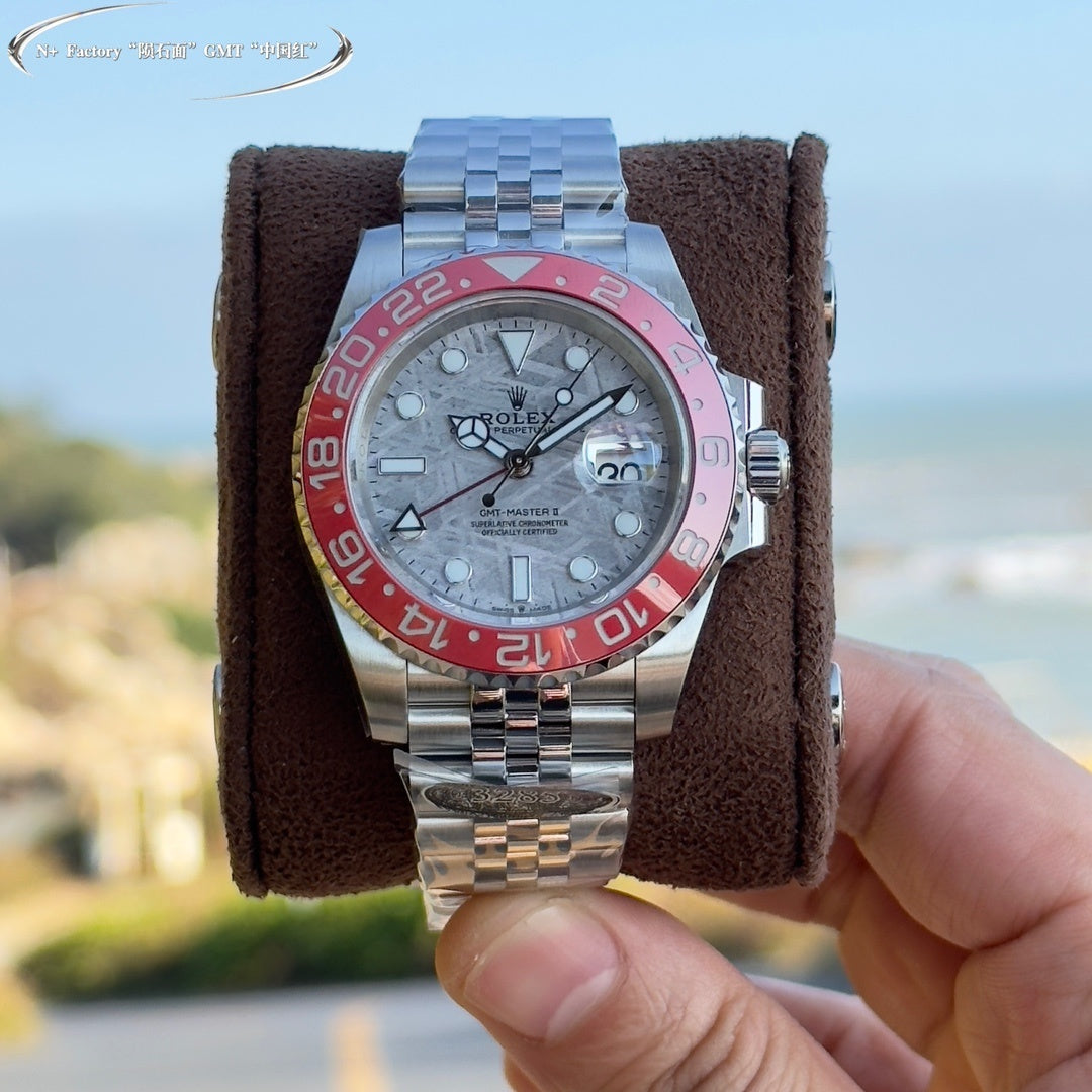 Rolex GMT-Master watch, stainless steel bracelet, light dial, pink-red bezel markers