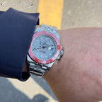 Rolex GMT-Master watch on wrist, steel bracelet, light dial, pink-red bezel