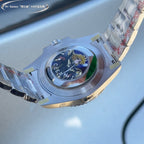 Rolex watch caseback with circular emblem, stainless steel case, angled view