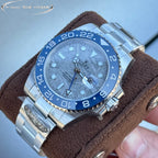 Rolex GMT-style watch with blue bezel and blue dial, steel bracelet, close-up angle
