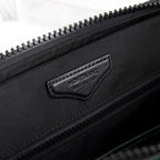 Montblanc men's dark bag exterior with logo patch and top zipper
