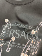 Black long-sleeve T-shirt chest graphic with Versace logo and charms
