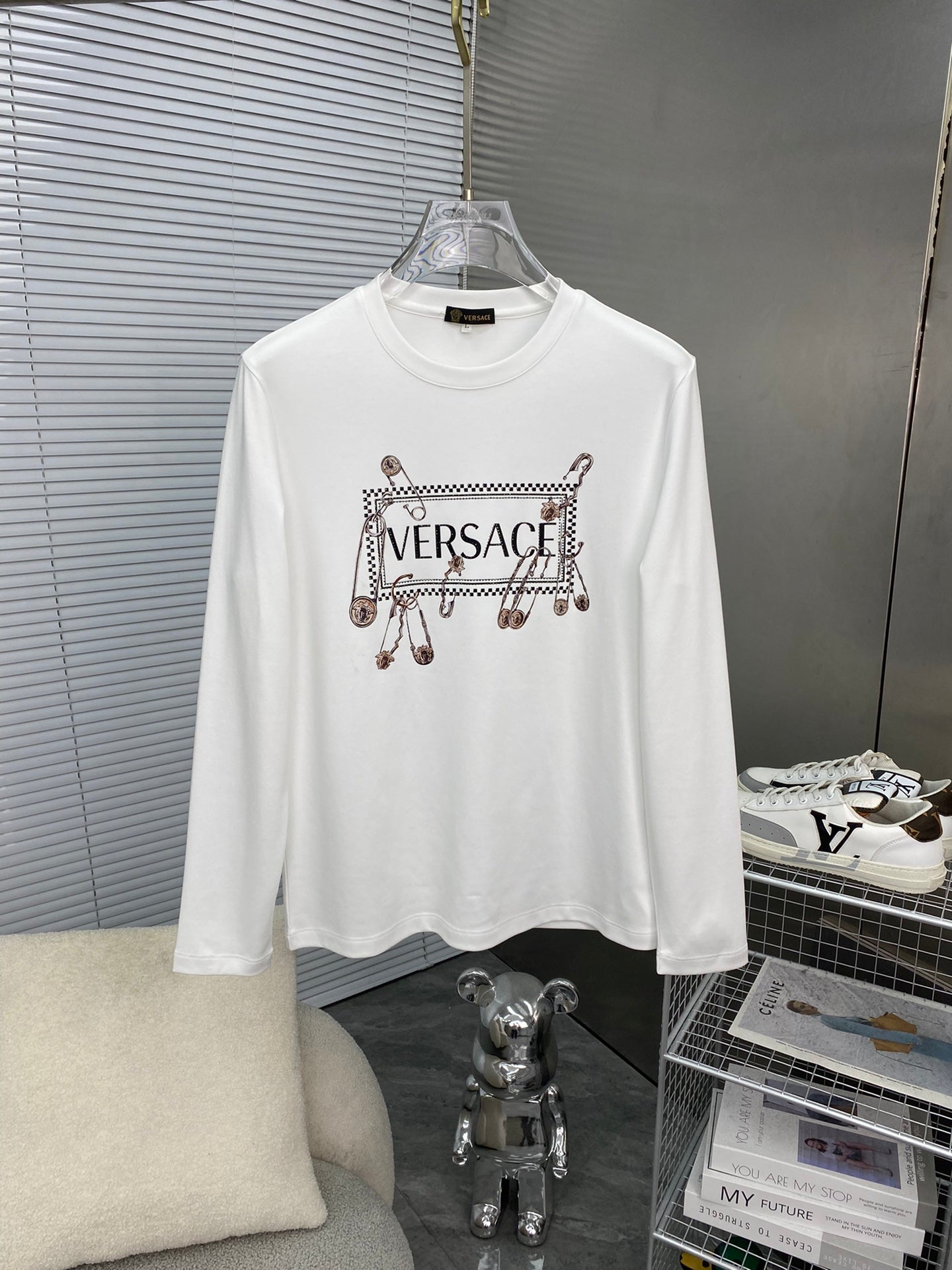 White long-sleeve T-shirt with Versace logo and charm graphic