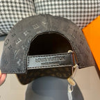 Louis Vuitton cap underside view with black lining and Louis Vuitton label on strap