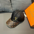 Louis Vuitton baseball cap with black monogram print and yellow LV logo, brown under brim