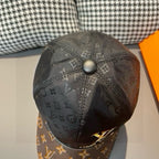 Louis Vuitton cap back panel with black monogram print and top button, partial brim
