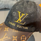 Louis Vuitton cap close-up: black monogram crown with yellow LV and Louis Vuitton text