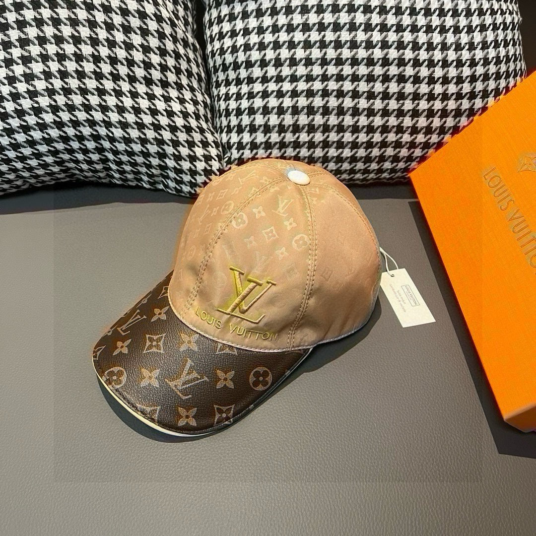 Louis Vuitton monogram baseball cap with tan crown and dark brim, gold LV logo