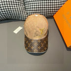 Louis Vuitton monogram baseball cap with tan crown, brown patterned brim, gold LV logo