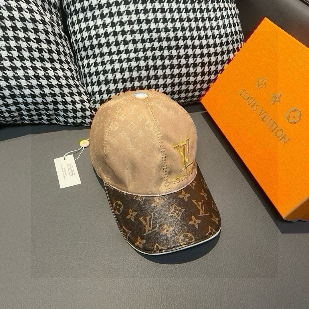 Louis Vuitton monogram baseball cap with tan crown and dark monogram brim, gold LV logo