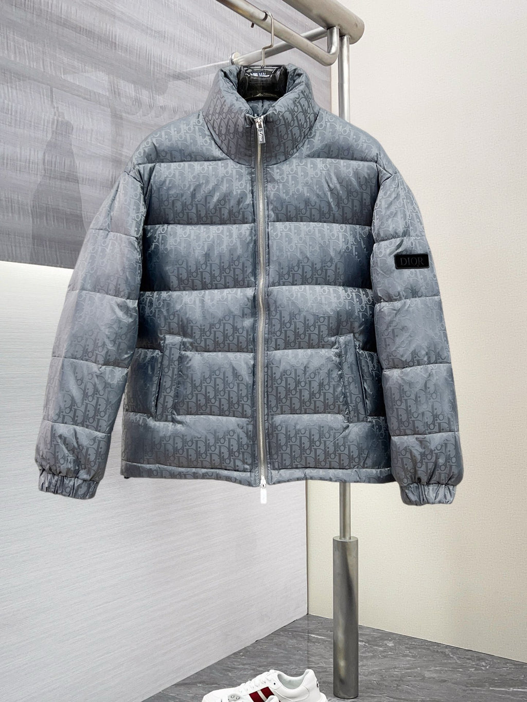 Long puffer jacket in light gray-blue with hood and full front zipper