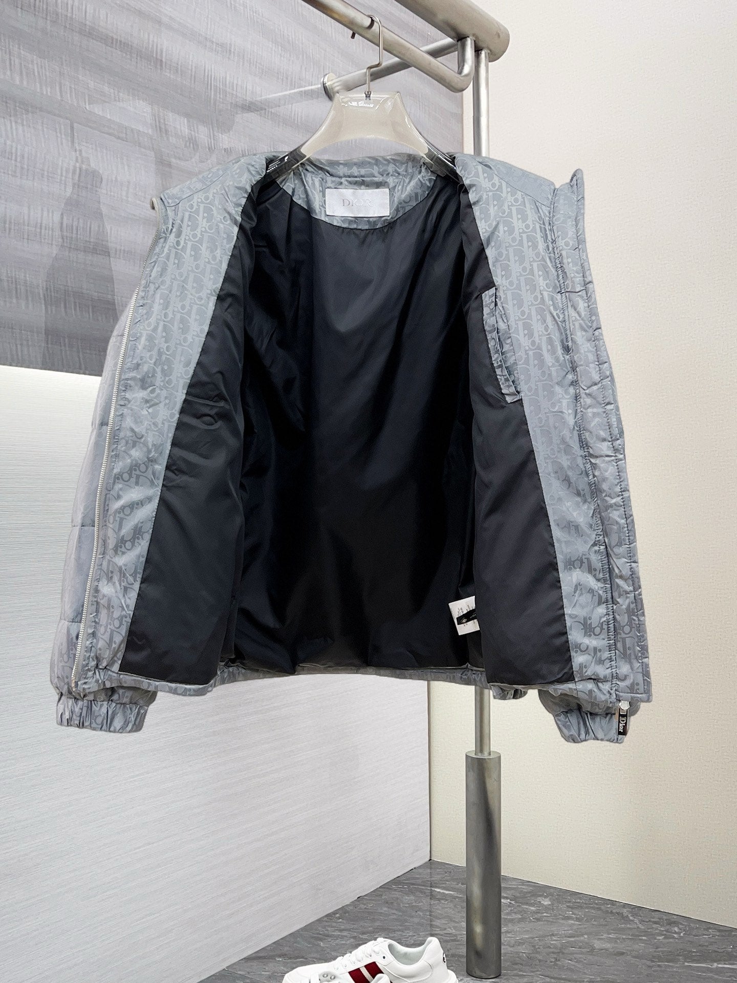 Long puffer jacket open view with dark interior lining and front zipper