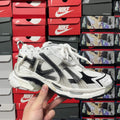 Unisex white lace-up sneakers with black logo stripes and chunky sole