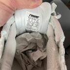 Unisex sneaker interior label with Runner sizing and leather upper details