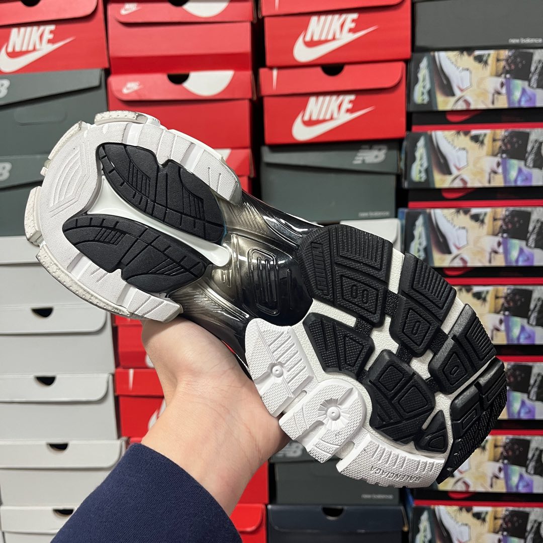 Unisex sneaker outsole with traction tread pattern and black flex panel