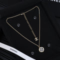 Gold-tone Chanel pendant necklace with chain links and round CC charm