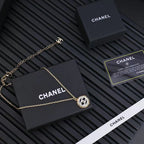 Gold-tone Chanel pendant necklace with small round CC charm on chain