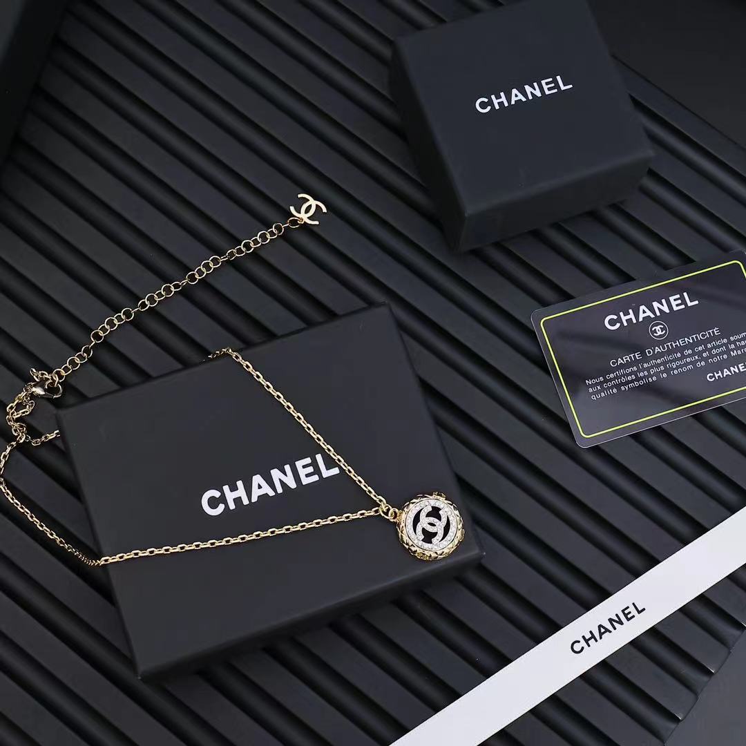 Gold-tone Chanel pendant necklace with small round CC charm on chain